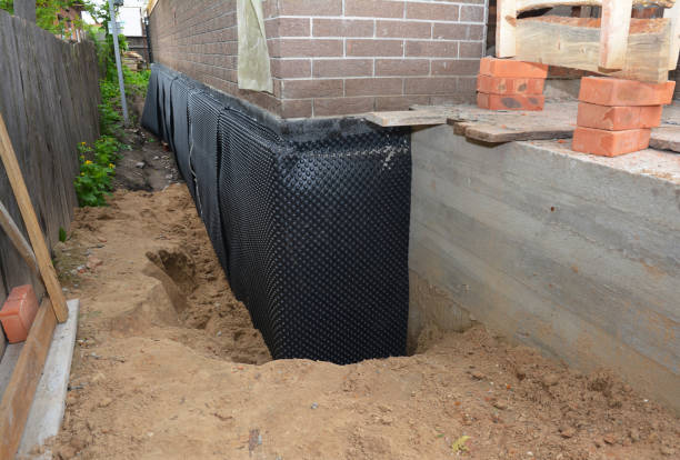 Happy homeowners after waterproofing job in Grove City